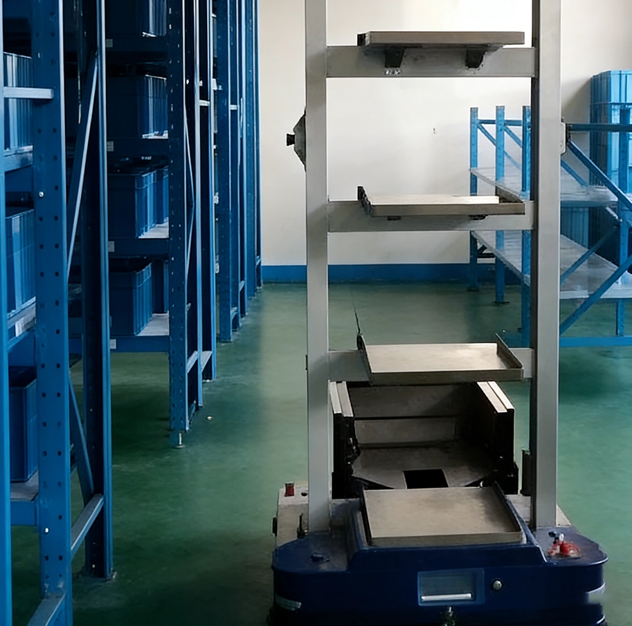Mini load automated storage and retrieval system stacker moving bins in a small parts storage area