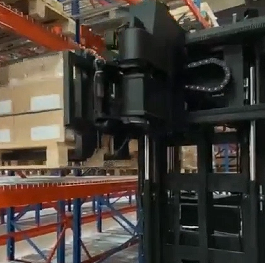 Unit load ASRS system handling palletized washing machine cartons inside an automated warehouse rack aisle